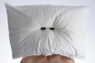 pillow mask. Pillow and eyeholes. Exhibited at Metro Arts/M.S.S.R., 2009. Courtesy the artist. 