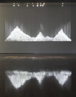 Floe, 2009. Installation view Samstag Museum of Art, Adelaide. Domestic crystal glassware, woven nylon thread, dimensions variable. Photography Samstag Museum. Courtesy of the artist and Ryan Renshaw, Brisbane.