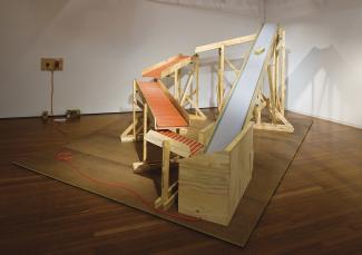 Big One Liner, 2008. Wood, ply, plastic, conveyor belt, electrics, bricks, 300 x 450 x 230cm. Installation view Roslyn Oxley9, Sydney. Photograph: Moshe Rosenberg.