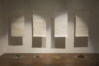 Broken the spell, 2014. Mixed media, dimensions variable. Hanging sculpture: handmade paper, tea, coffee, hand-dyed thread, 90 x 30cm. Courtesy the artist.