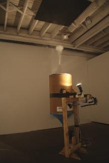 Ol’smokey, 2008. Smoke machine, electrics, lycra, card, timber, light, 60 x 80 x 170cms. Installation views Firstdraft Gallery, Sydney. Photographs: Kat Barron.